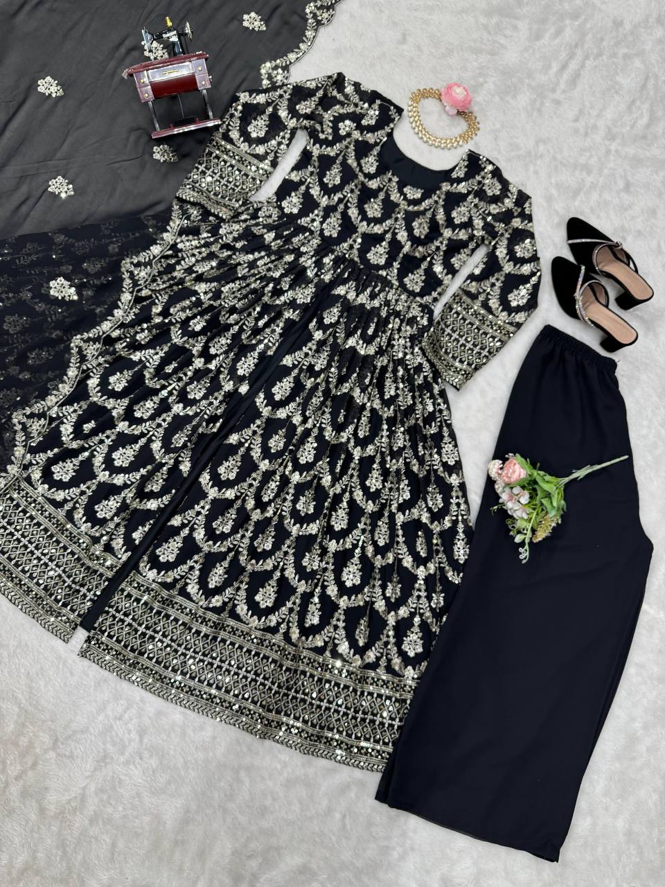 Three-piece ensemble featuring a faux georgette top pent with dupatta