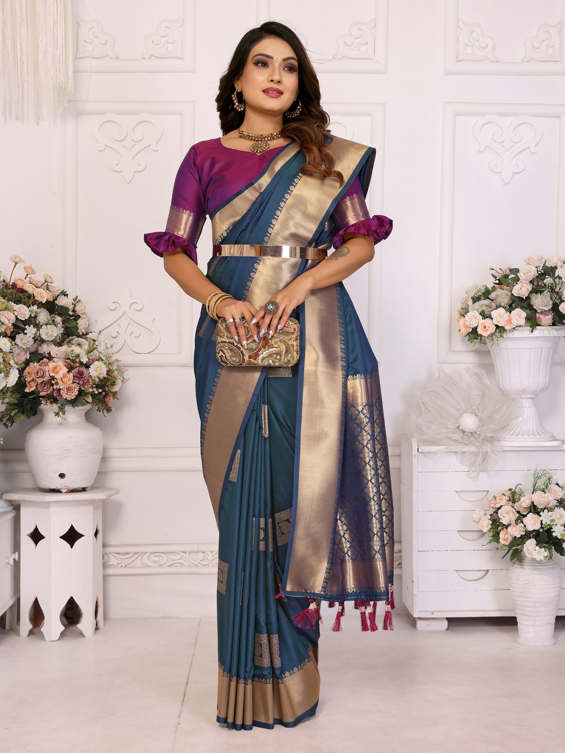 Soft Silk Saree featuring an elegant woven Butta motif embellishing the body