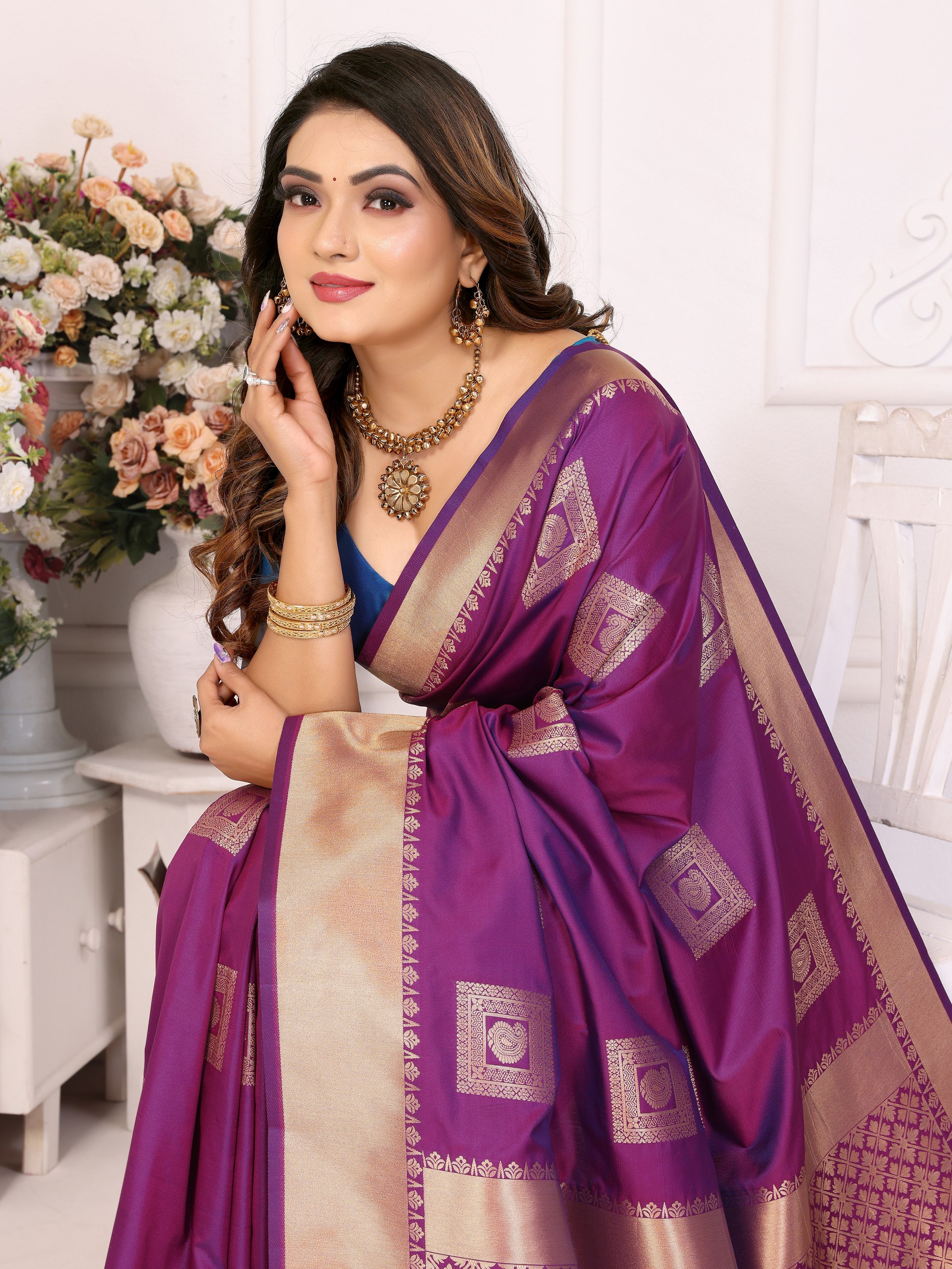 Soft Silk Saree featuring an elegant woven Butta motif embellishing the body