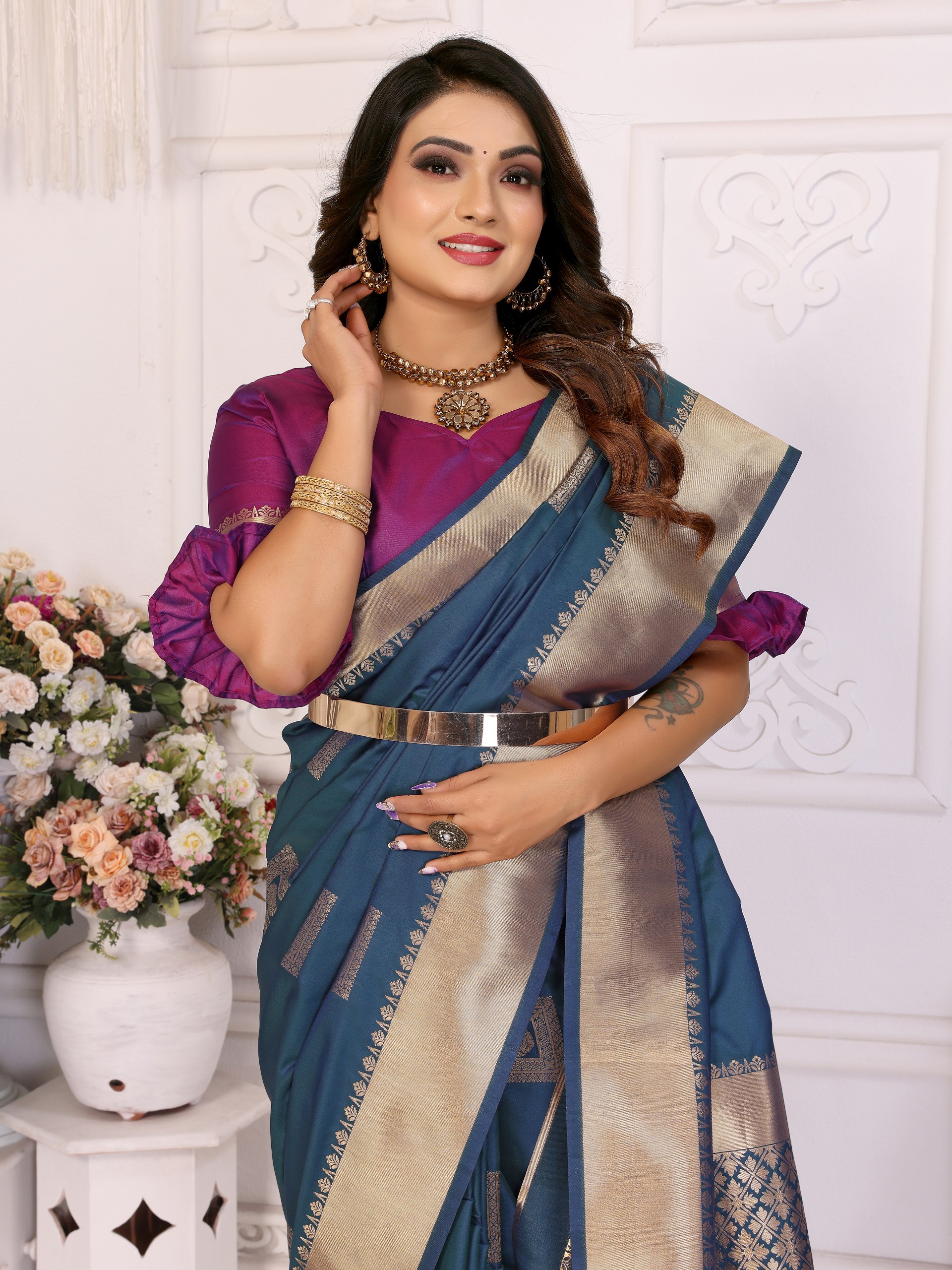 Soft Silk Saree featuring an elegant woven Butta motif embellishing the body