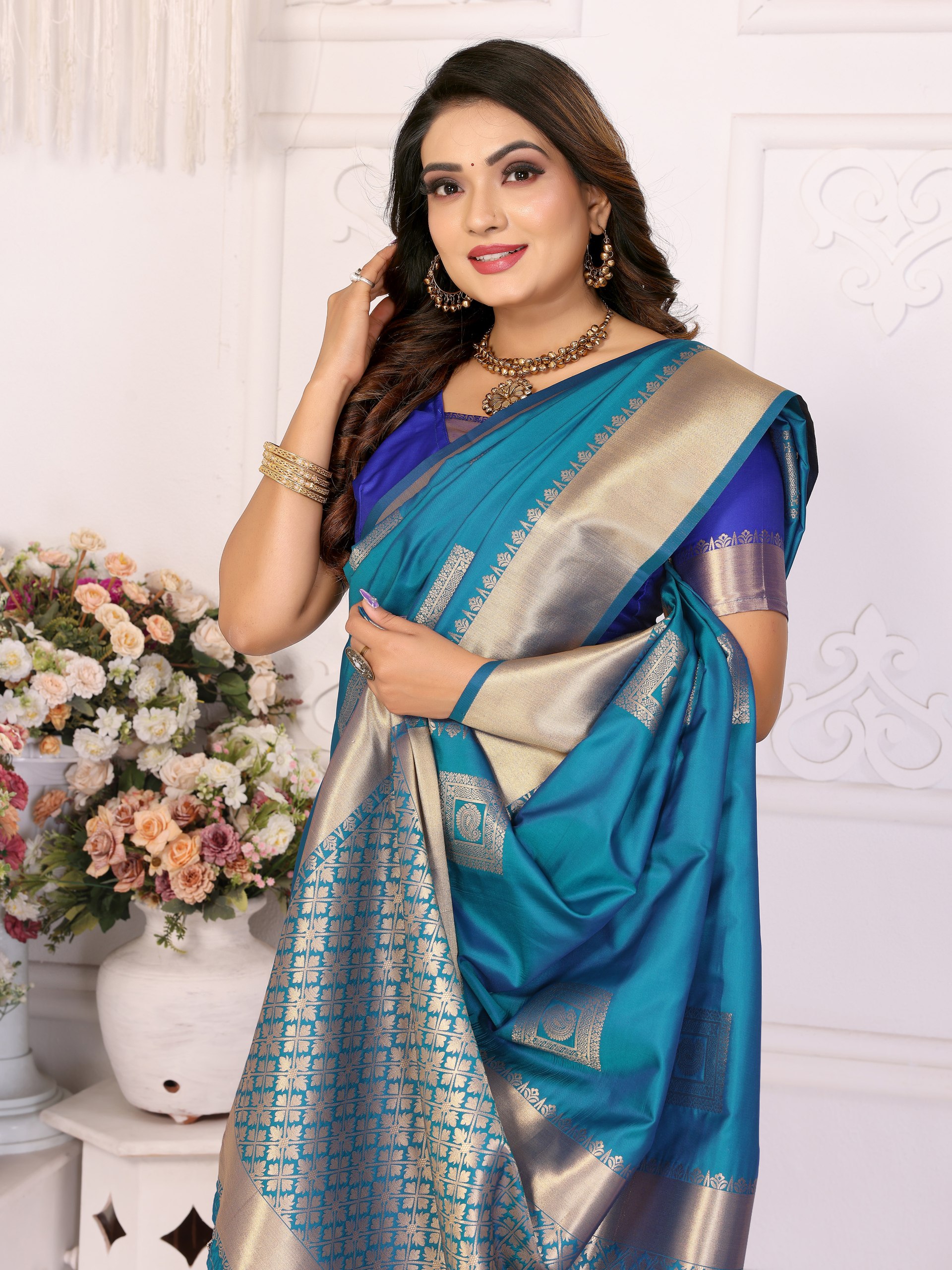 Soft Silk Saree featuring an elegant woven Butta motif embellishing the body