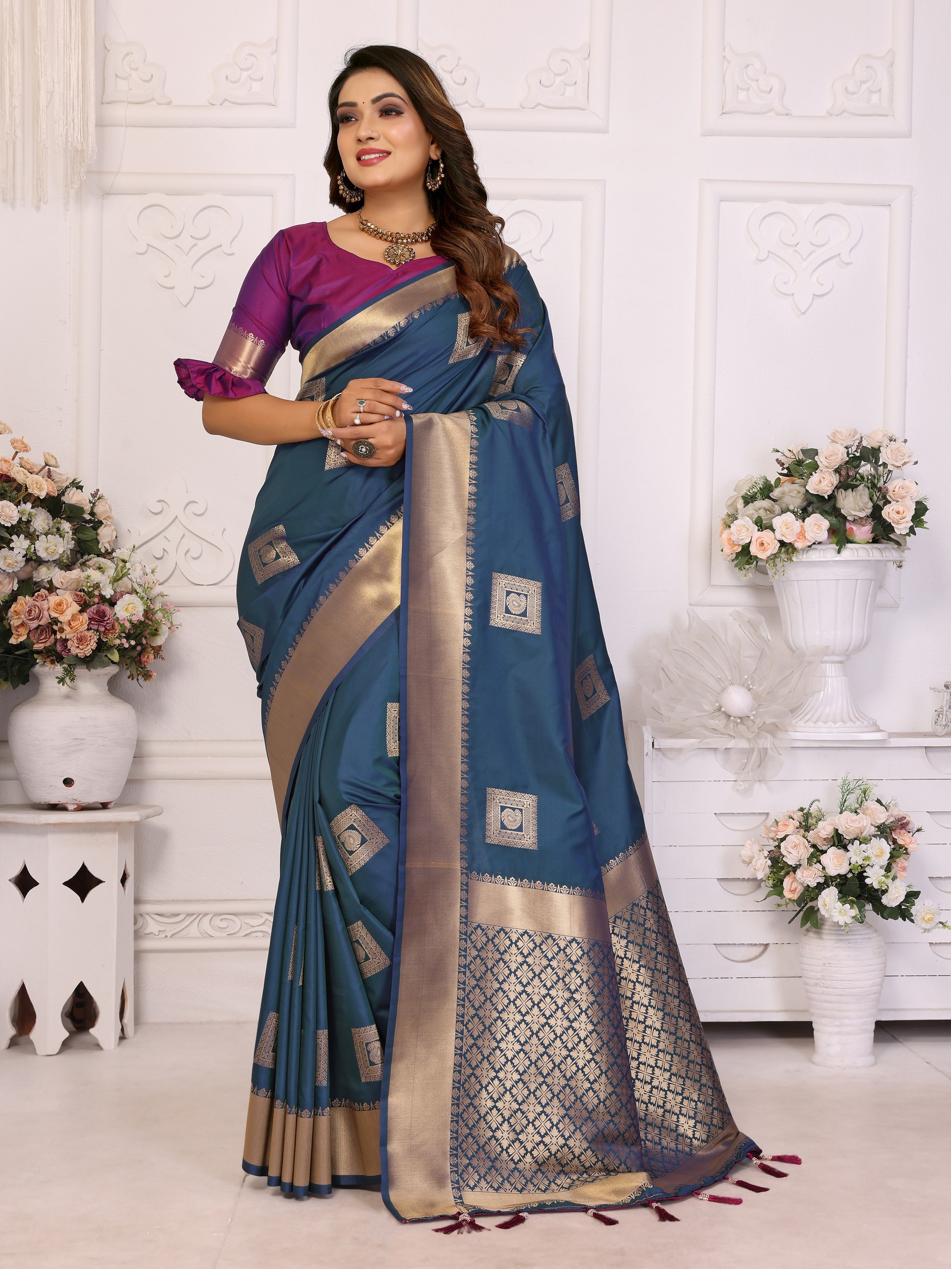Soft Silk Saree featuring an elegant woven Butta motif embellishing the body